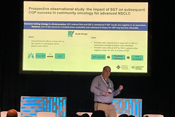 Presentor at CB Exchange showing a slide labeled: "Prospective observational study: the impact of SGT on subsequent CGP success in community oncology for advanced NSCLC