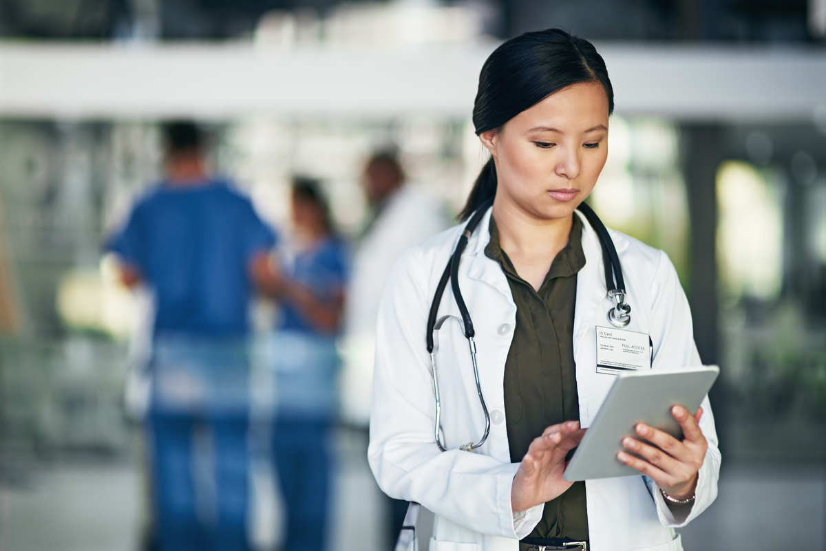 Shot of a doctor using a digital tablet in a hospital