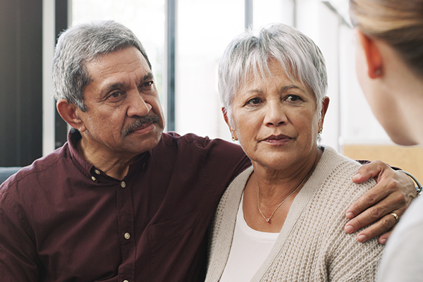 Shot of a senior couple having a consultation with a doctor at home
